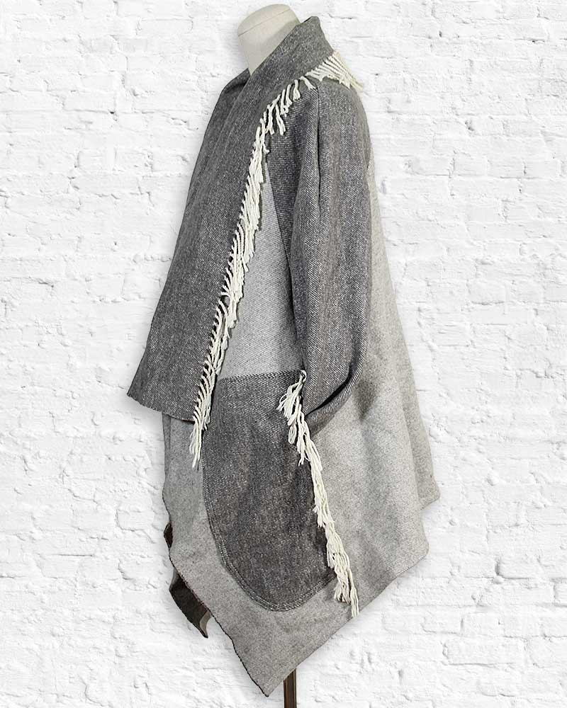 Gray textured coat with white fringe details on a white background