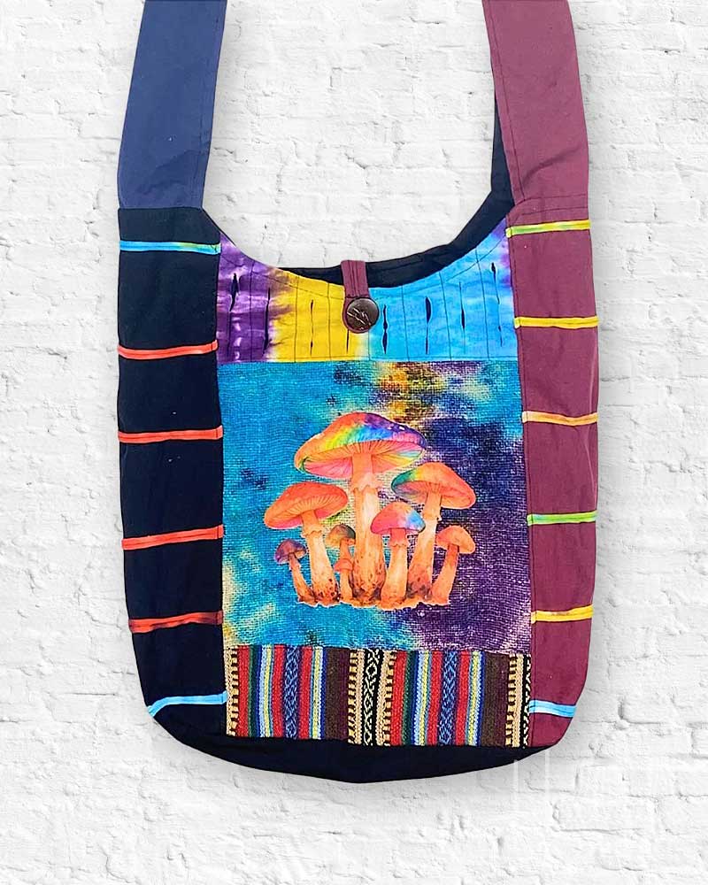 Colorful handbag with mushroom design and striped patterns on a white brick wall background