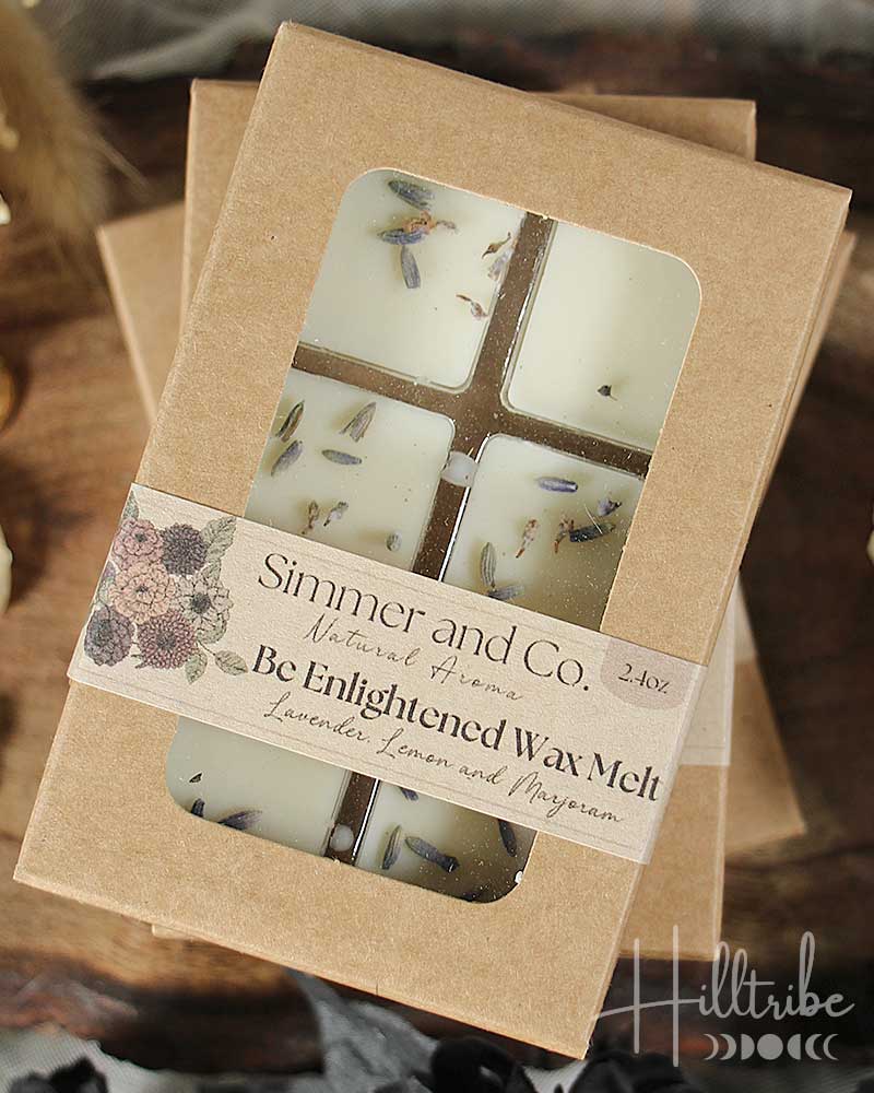 Packaged wax melts with decorative elements on a wooden surface