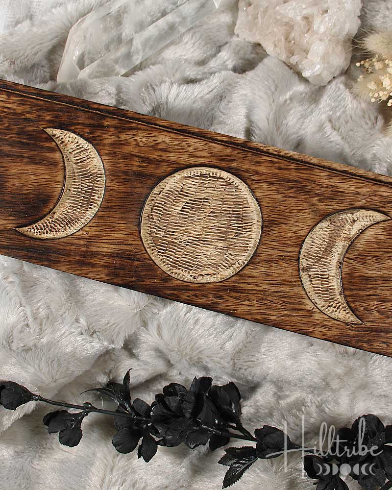 Triple Moon Tarot Card Holder with moon phases on a textured white surface