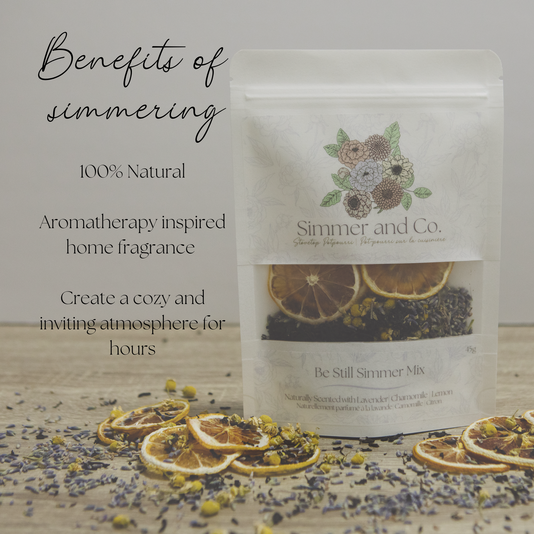 Simmer and Co. simmer mix packaging with dried fruits and flowers on a wooden surface.