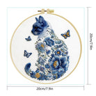 Embroidery hoop with a blue cat and floral design, featuring butterflies, on a white background with dimensions indicated.