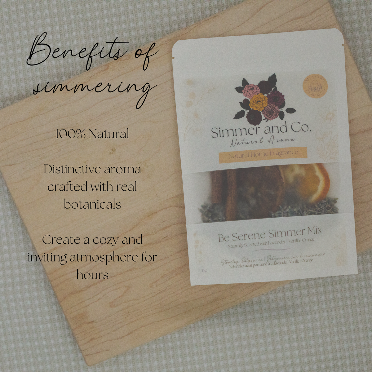 A package of Simmer and Co. Be Serene Simmer Mix natural aroma sachets is displayed on a light wooden board with text overlays detailing the benefits of simmering.