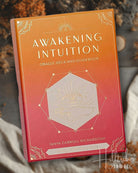 Deck titled 'Awakening Intuition' with a decorative cover on a textured surface