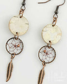 Pair of earrings with dreamcatcher design on a white background