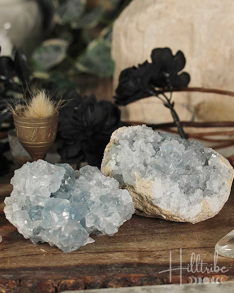 Crystal rock formations on a wooden surface with blurred background