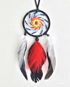 Colorful dreamcatcher with feathers on a white background