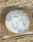 Dendritic Agate palm stone on a decorative gold tray