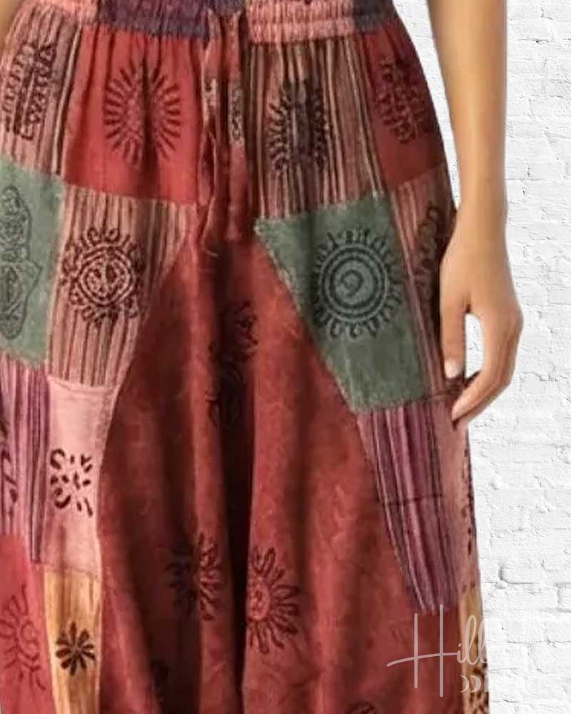 Multicolored patchwork skirt with a white brick wall background