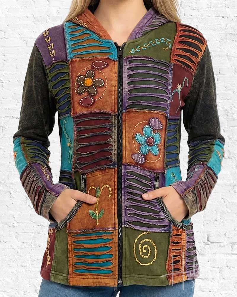 Colorful patchwork jacket with floral and abstract designs on a white background