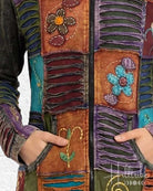 Colorful patchwork jacket with floral and abstract designs.