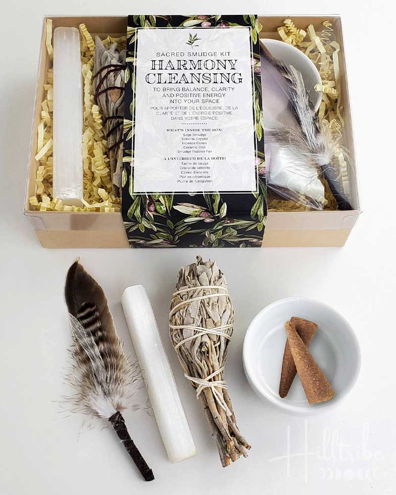 Harmony Cleansing smudge kit with incense, feather, and other items on a white background