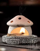 Mushroom House Smudge Pot with a burning palo santo stick