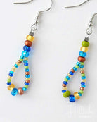 Colorful beaded earrings on a white background