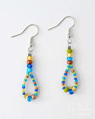 Colorful beaded earrings on a white background