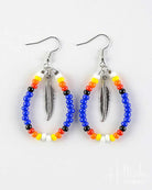 Pair of hoop earrings with colorful beads and feather charms on a white background