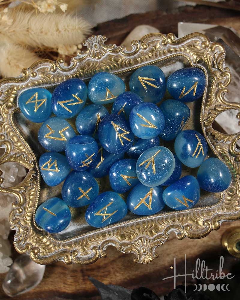 Blue Onyx stones with gold runes on an ornate silver tray, with 'Hilltribe' branding.