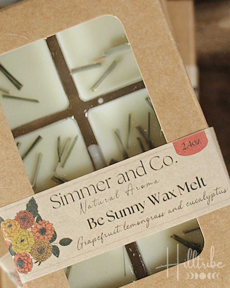 Box of 'Be Sunny' wax melts by Simmer and Co. with a floral label.
