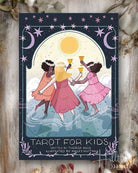 Cover of 'Tarot for Kids' deck with three illustrated girls holding cups against a starry night sky.