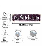 A product information graphic for a rustic wooden sign reading 'The Witch is in'. The sign is shown on a white background with feature icons and text noting weather resistance, high definition printing, pre-drilled holes, rounded rolled edges, and waterproof laminate edges.